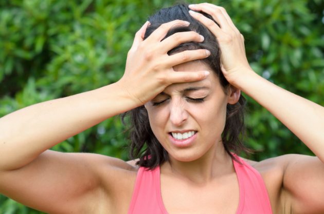 Woman painful head ache